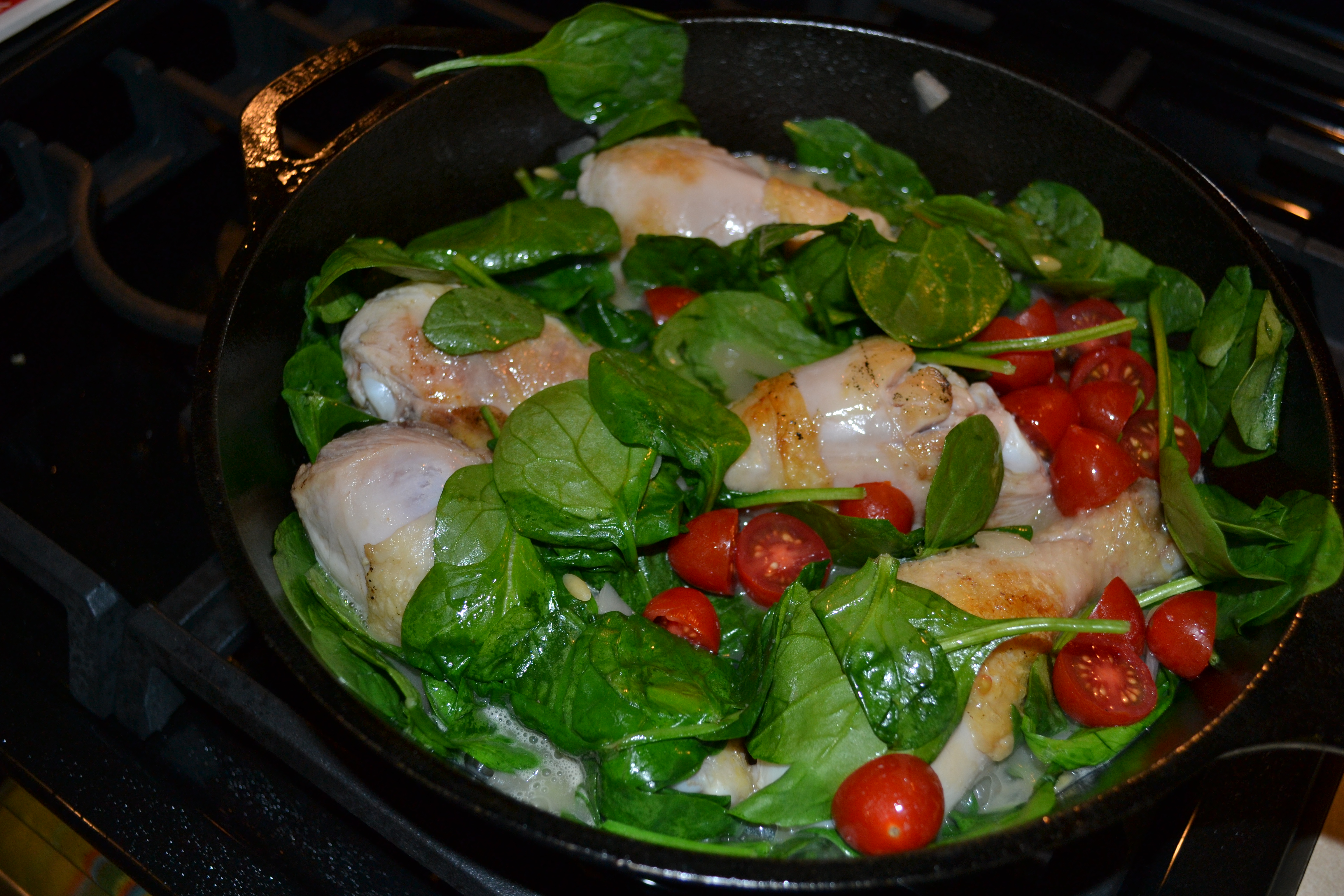 spinach tomatoes and chicken orzo simmer