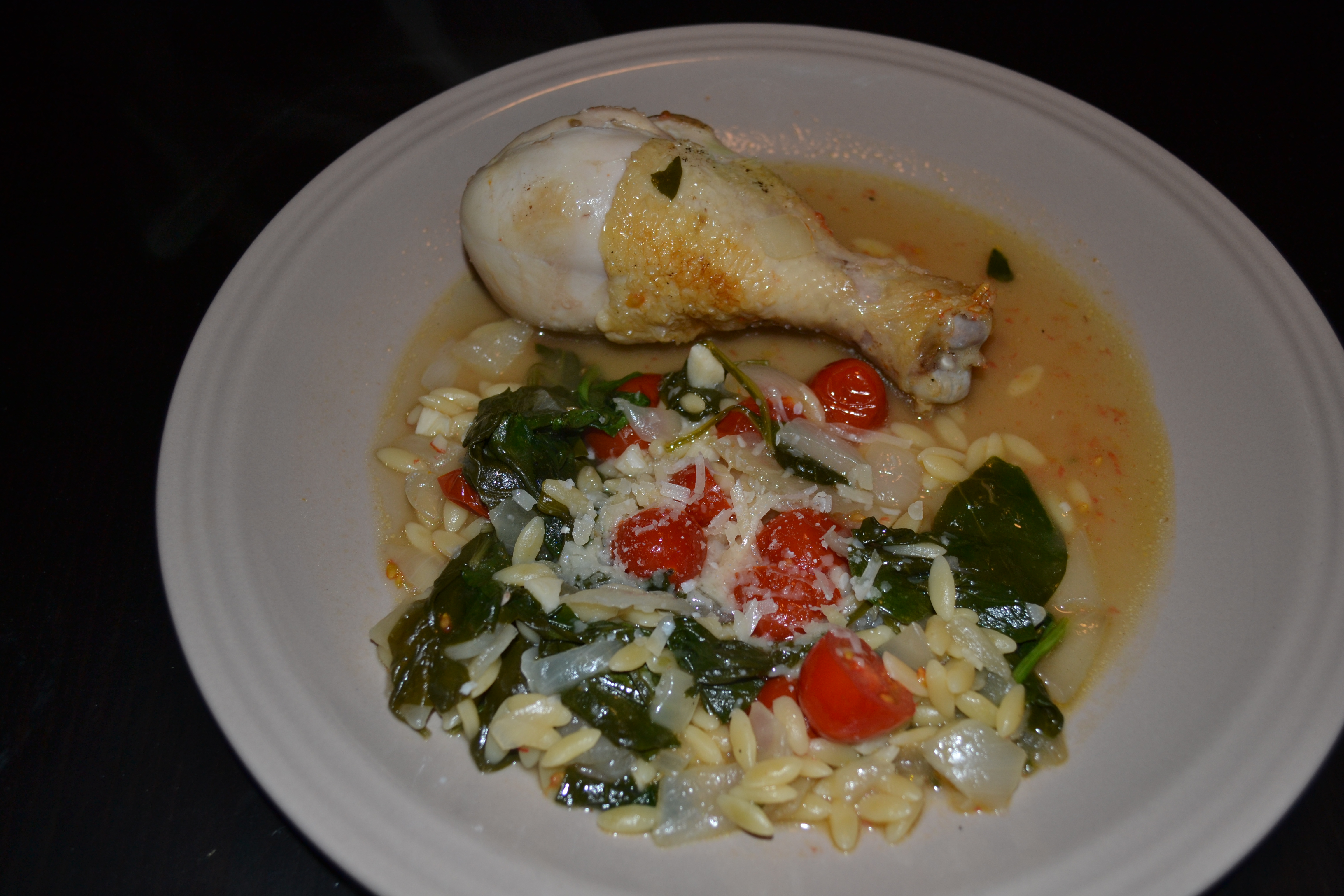 spinach tomatoes and chicken orzo plated